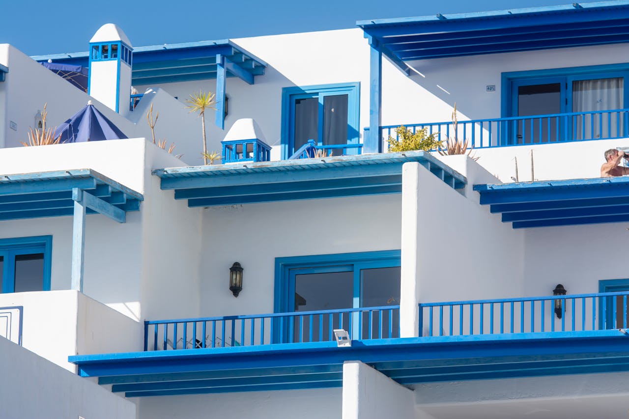 Bright blue and white contemporary building exterior in Lanzarote, showcasing Mediterranean architecture. Perfect vacation spot.